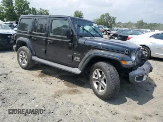 2019 Jeep Wrangler Unlimited Sahara with VIN 1C4HJXEN5KW523978, listed as a Copart auction lot 60188735 with 21,937 mi miles and Salvage title. Bid and sale history available at DreamBid. Image 4.