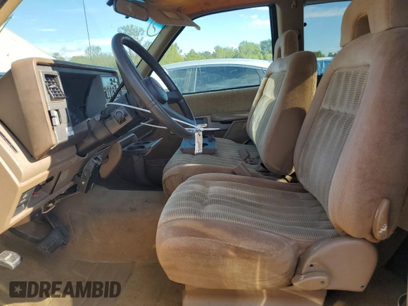 1994 GMC Sierra 1500 with VIN 1GTEC19KXRE557960, listed as a Copart auction lot 71677974 with 194,641 mi miles and Salvage Title. Bid and sale history available at DreamBid. Image 7.