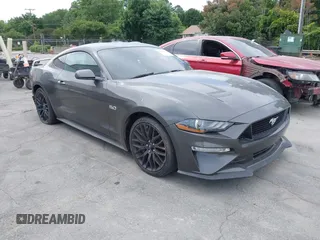 2019 Ford Mustang GT z VIN 1FA6P8CF0K5124320, wystawiony jako IAAI lot #42314129 z przebiegiem 102 589 mil mil oraz . Historia ofert i sprzedaży dostępna na DreamBid. Obrazek 1.
