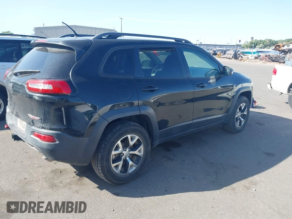 2015 Jeep Cherokee Trailhawk with VIN 1C4PJMBS4FW556822, listed as a IAAI auction lot 42412874 with 129,865 mi miles and . Bid and sale history available at DreamBid. Image 4.