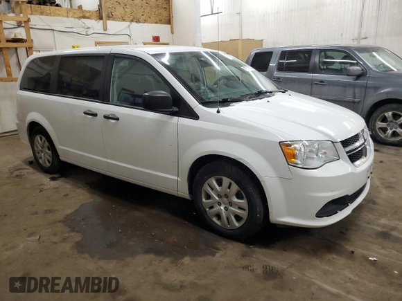 2020 Dodge Grand Caravan SE with VIN 2C4RDGBG0LR196885, listed as a Copart auction lot 43585545 with 124,942 mi miles and Salvage Title. Bid and sale history available at DreamBid. Image 4.