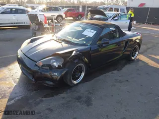 2000 Toyota MR2 Spyder with VIN JTDFR3204Y0020262, listed as a IAAI auction lot 41823386 with 203,044 mi miles. Bid and sale history available at carsss.com. Image 2.