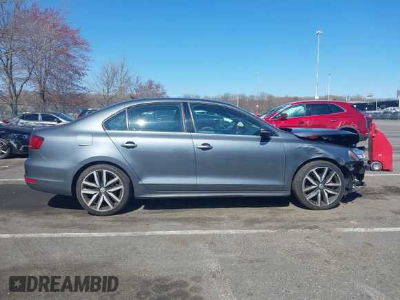 2014 Volkswagen Jetta GLI z VIN 3VW4T7AJ6EM360187, wystawiony jako IAAI lot #41932099 z przebiegiem 71 647 mil mil oraz . Historia ofert i sprzedaży dostępna na DreamBid. Obrazek 13.