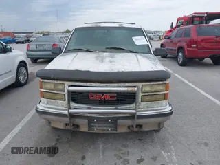 1997 GMC Yukon with VIN 1GKEK13R2VJ739795, listed as a IAAI auction lot 42011678 with 185,306 mi miles. Bid and sale history available at carsss.com. Image 6.