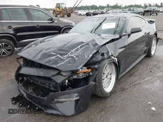 2022 Ford Mustang EcoBoost with VIN 1FA6P8TH2N5113664, listed as a IAAI auction lot 42314252 with 55,130 mi miles and . Bid and sale history available at DreamBid. Image 2.