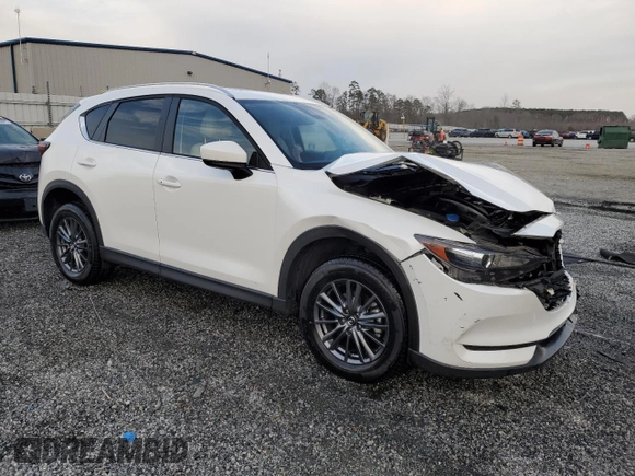 2020 Mazda CX-5 Touring with VIN JM3KFACM0L0863937, listed as a Copart auction lot 48240655 with 70,592 mi miles and Salvage Title. Bid and sale history available at carsss.com. Image 4.