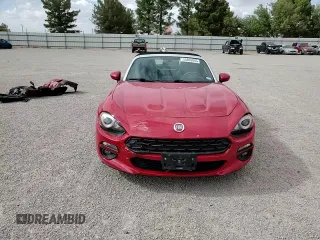 2017 FIAT 124 Spider Lusso z VIN JC1NFAEK5H0123760, wystawiony jako Copart lot #55865845 z przebiegiem 52 285 mil mil oraz Szkoda całkowita • Salvage title. Historia ofert i sprzedaży dostępna na DreamBid. Obrazek 13.