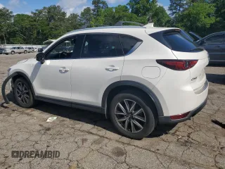 2018 Mazda CX-5 Grand Touring с VIN JM3KFADM3J1351532, выставлен на аукционе Copart как лот 55567405 с пробегом 99 134 миль миль и Списание • Salvage title. История ставок и продаж доступна на DreamBid. Изображение 2.