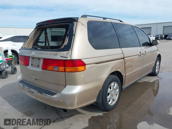 2002 Honda Odyssey EX-L z VIN 2HKRL18042H567858, wystawiony jako IAAI lot #41686147 z przebiegiem 264 570 mil mil oraz . Historia ofert i sprzedaży dostępna na DreamBid. Obrazek 4.