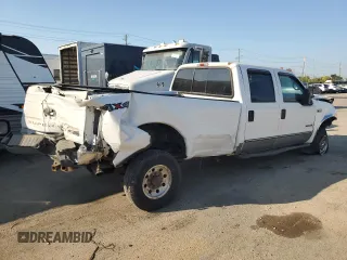 2000 Ford F-350 XL with VIN 1FTSW31F7YED79895, listed as a Copart auction lot 71744804 with 176,241 mi miles and Salvage Title. Bid and sale history available at DreamBid. Image 3.