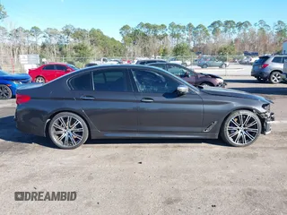 2018 BMW 5 Series M550i xDrive with VIN WBAJB9C57JG463933, listed as a IAAI auction lot 41295711 with 99,173 mi miles and . Bid and sale history available at carsss.com. Image 13.