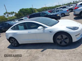 2018 Tesla Model 3 Long Range Battery with VIN 5YJ3E1EAXJF027179, listed as a IAAI auction lot 42059918 with 43,566 mi miles. Bid and sale history available at carsss.com. Image 14.
