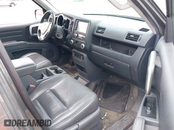 2007 Honda Ridgeline RTL z VIN 2HJYK16517H511157, wystawiony jako IAAI lot #42257637 z przebiegiem 266 894 mil mil oraz . Historia ofert i sprzedaży dostępna na DreamBid. Obrazek 5.