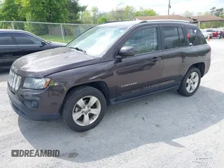 2014 Jeep Compass Latitude with VIN 1C4NJDEBXED622352, listed as a IAAI auction lot 42130403 with 149,024 mi miles. Bid and sale history available at carsss.com. Image 2.