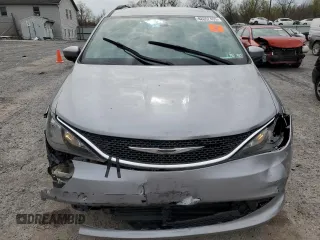 2021 Chrysler Voyager LXi with VIN 2C4RC1DG0MR521145, listed as a Copart auction lot 48062405 with 144,197 mi miles and Salvage Title. Bid and sale history available at DreamBid. Image 5.