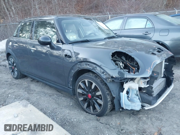 2016 MINI Cooper Hardtop 4 Door S with VIN WMWXU3C56G2B63682, listed as a IAAI auction lot 41244676 with 110,902 mi miles. Bid and sale history available at carsss.com. Image 14.