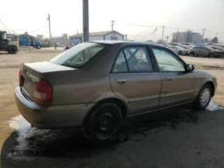 1999 Mazda Protege DX z VIN JM1BJ2223X0137153, wystawiony jako Copart lot #87899735 z przebiegiem 154 209 mil mil oraz Szkoda całkowita • Salvage title. Historia ofert i sprzedaży dostępna na DreamBid. Obrazek 3.