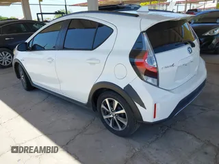 2018 Toyota Prius One with VIN JTDKDTB32J1600004, listed as a IAAI auction lot 42030186 with 61,568 mi miles and . Bid and sale history available at DreamBid. Image 3.