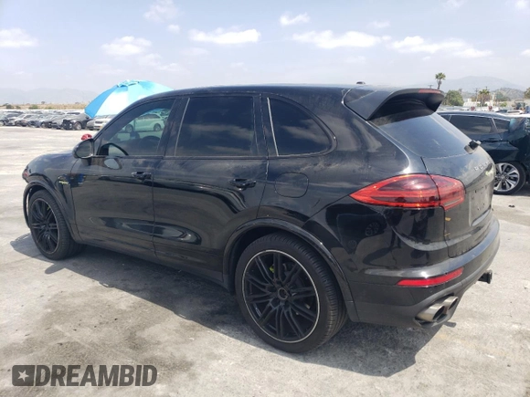 2017 Porsche Cayenne S E-Hybrid with VIN WP1AE2A23HLA71302, listed as a Copart auction lot 54586635 with 102,228 mi miles and Salvage title. Bid and sale history available at DreamBid. Image 2.