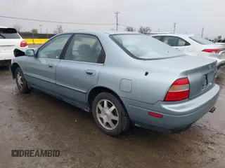 1994 Honda Accord EX w/Leather with VIN 1HGCD5657RA119657, listed as a IAAI auction lot 41528165 with 119,458 mi miles. Bid and sale history available at carsss.com. Image 3.
