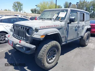 2023 Jeep Wrangler Rubicon with VIN 1C4JJXFG7PW541813, listed as a IAAI auction lot 42640045 with 53,645 mi miles and . Bid and sale history available at DreamBid. Image 2.