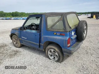 1993 Geo Tracker z VIN 2CNBJ18UXP6921660, wystawiony jako Copart lot #58027275 z przebiegiem 64 349 mil mil oraz Tytuł czysty. Historia ofert i sprzedaży dostępna na DreamBid. Obrazek 2.