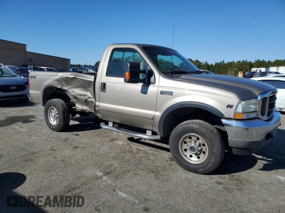 2002 Ford F-250 XL with VIN 1FTNF21L02EA83007, listed as a Copart auction lot 87880345 with 104,889 mi miles and Salvage title. Bid and sale history available at DreamBid. Image 4.