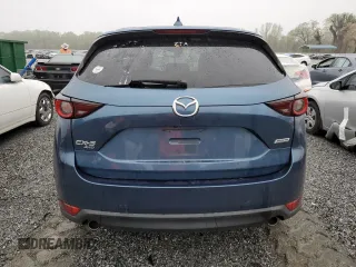 2017 Mazda CX-5 Touring with VIN JM3KFBCLXH0124451, listed as a Copart auction lot 51060275 with 126,807 mi miles and Salvage Title. Bid and sale history available at carsss.com. Image 6.