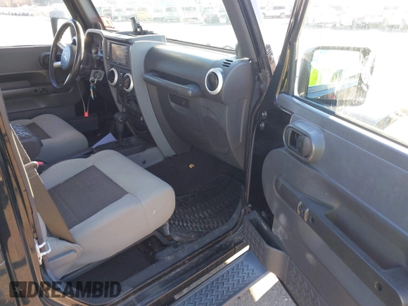 2010 Jeep Wrangler Unlimited Sahara with VIN 1J4HA5H16AL215659, listed as a IAAI auction lot 41749218 with 55,544 mi miles. Bid and sale history available at carsss.com. Image 5.