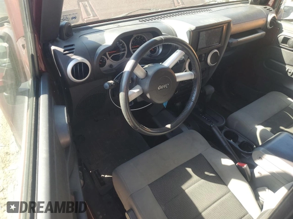 2010 Jeep Wrangler Sahara с VIN 1J4GA5D16AL225139, выставлен на аукционе Copart как лот 77114204 с пробегом Не указан миль и Списание • Salvage title. История ставок и продаж доступна на DreamBid. Изображение 8.
