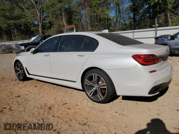 2016 BMW 7 Series 750i with VIN WBA7F0C58GGM20723, listed as a Copart auction lot 80143764 with 102,311 mi miles and Salvage Title. Bid and sale history available at carsss.com. Image 2.