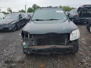 2011 Mercury Mariner Premier z VIN 4M2CN9HG1BKJ00209, wystawiony jako Copart lot #57016475 z przebiegiem 224 019 mil mil oraz Szkoda całkowita • Salvage title. Historia ofert i sprzedaży dostępna na DreamBid. Obrazek 5.