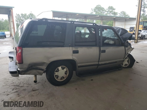 1999 GMC Yukon with VIN 1GKEC13R4XJ735246, listed as a Copart auction lot 56429874 with 258,616 mi miles and Salvage Title. Bid and sale history available at carsss.com. Image 3.