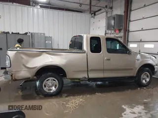 1999 Ford F-150 with VIN 1FTRX18W0XKA68363, listed as a IAAI auction lot 41524104 with 218,400 mi miles and . Bid and sale history available at DreamBid. Image 14.