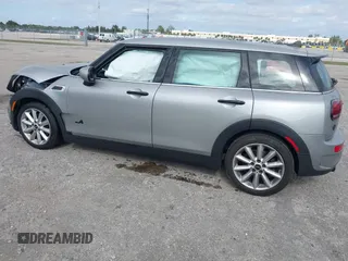 2023 MINI Clubman Cooper S with VIN WMWXJ1C03P2U08484, listed as a IAAI auction lot 41056651 with 12,948 mi miles. Bid and sale history available at carsss.com. Image 3.
