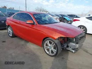 2015 BMW 2 Series 228i with VIN WBA1F9C56FVW98461, listed as a IAAI auction lot 41663193 with 94,584 mi miles. Bid and sale history available at carsss.com. Image 1.