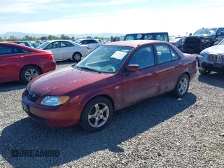 2003 Mazda Protege DX with VIN JM1BJ225930195479, listed as a IAAI auction lot 42199689 with 148,382 mi miles and . Bid and sale history available at DreamBid. Image 2.