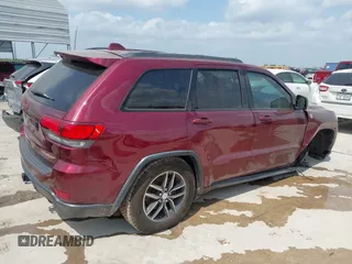 2017 Jeep Grand Cherokee Trailhawk with VIN 1C4RJFLG3HC699828, listed as a IAAI auction lot 42135444 with 98,596 mi miles and . Bid and sale history available at DreamBid. Image 4.