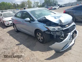 2017 Chevrolet Cruze LS z VIN 1G1BC5SM8H7277388, wystawiony jako IAAI lot #41953145 z przebiegiem Nie podano mil oraz . Historia ofert i sprzedaży dostępna na DreamBid. Obrazek 1.