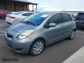 2009 Toyota Yaris with VIN JTDKT903295237216, listed as a IAAI auction lot 42087676 with 158,341 mi miles. Bid and sale history available at carsss.com. Image 2.