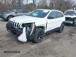 2014 Jeep Cherokee Trailhawk with VIN 1C4PJMBS5EW240375, listed as a IAAI auction lot 41806725 with 127,705 mi miles. Bid and sale history available at carsss.com. Image 2.