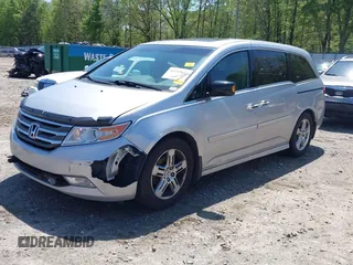 2012 Honda Odyssey Touring with VIN 5FNRL5H96CB043939, listed as a IAAI auction lot 41983643 with 202,535 mi miles. Bid and sale history available at carsss.com. Image 18.