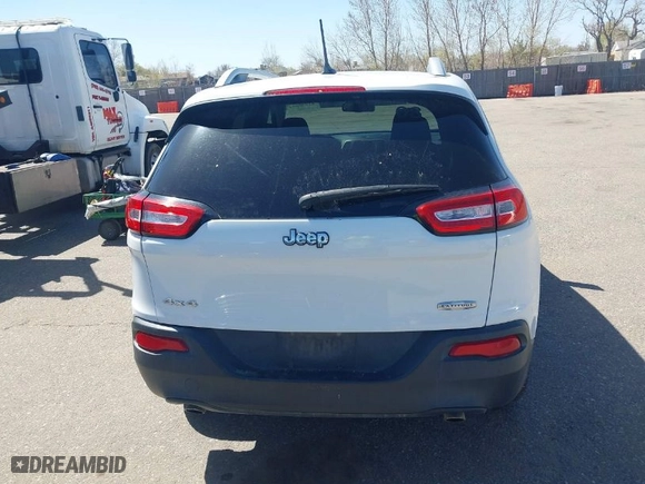 2014 Jeep Cherokee Latitude with VIN 1C4PJMCS4EW233979, listed as a IAAI auction lot 41976651 with 138,815 mi miles. Bid and sale history available at carsss.com. Image 16.