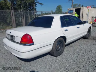 1999 Ford Crown Victoria LX with VIN 2FAFP74W7XX185341, listed as a IAAI auction lot 42020186 with 178,997 mi miles. Bid and sale history available at carsss.com. Image 4.