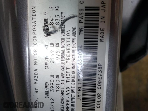 2012 Mazda 3 i Grand Touring with VIN JM1BL1M7XC1659084, listed as a Copart auction lot 49064185 with 104,883 mi miles and Salvage Title. Bid and sale history available at DreamBid. Image 13.