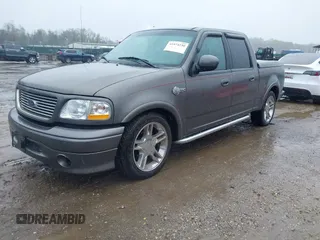 2002 Ford F-150 Harley Davidson with VIN 1FTRW07392KD29874, listed as a IAAI auction lot 41974230 with 163,279 mi miles. Bid and sale history available at carsss.com. Image 2.