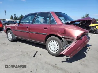 1991 Toyota Camry DLX z VIN 4T1SV21E7MU414824, wystawiony jako Copart lot #61604434 z przebiegiem 170 867 mil mil oraz Szkoda całkowita • Salvage title. Historia ofert i sprzedaży dostępna na DreamBid. Obrazek 2.