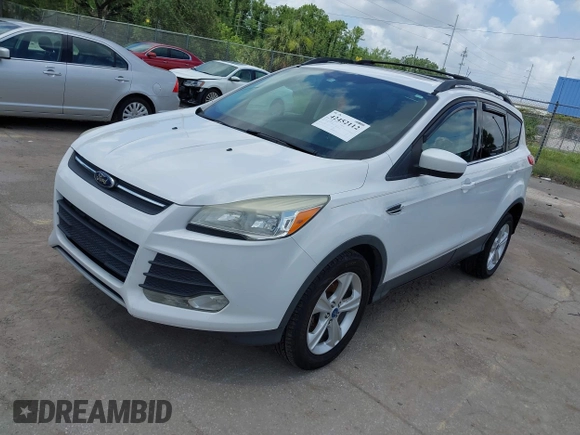 2013 Ford Escape SE with VIN 1FMCU0GX5DUA85464, listed as a IAAI auction lot 42452112 with 158,081 mi miles and . Bid and sale history available at DreamBid. Image 2.