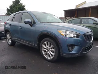 2015 Mazda CX-5 Grand Touring with VIN JM3KE4DY0F0493969, listed as a IAAI auction lot 41581885 with 71,014 mi miles. Bid and sale history available at carsss.com. Image 1.