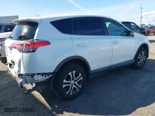2018 Toyota RAV4 LE with VIN 2T3ZFREV8JW467744, listed as a IAAI auction lot 41818614 with 95,609 mi miles. Bid and sale history available at carsss.com. Image 4.